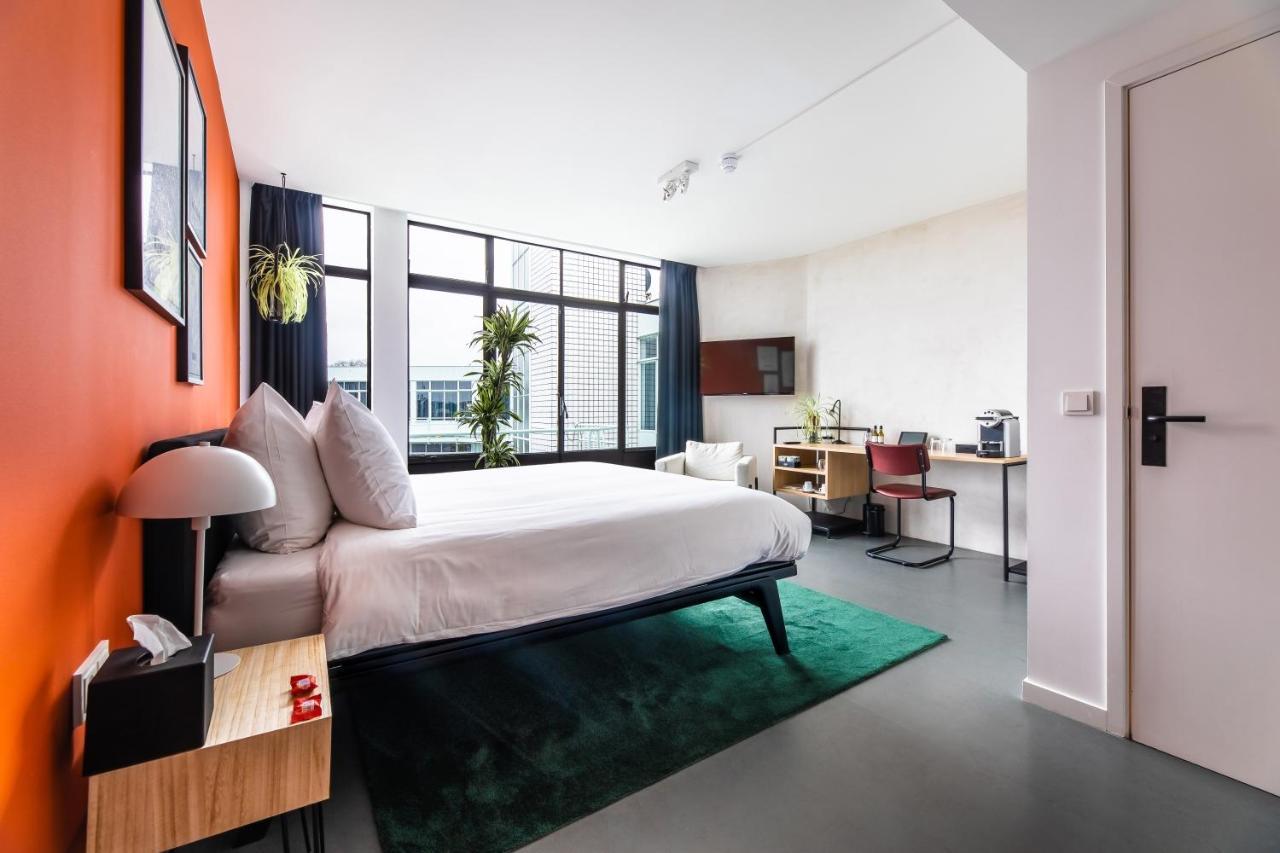 Gooiland Hotel ฮิลเวอร์ชุม ภายนอก รูปภาพ