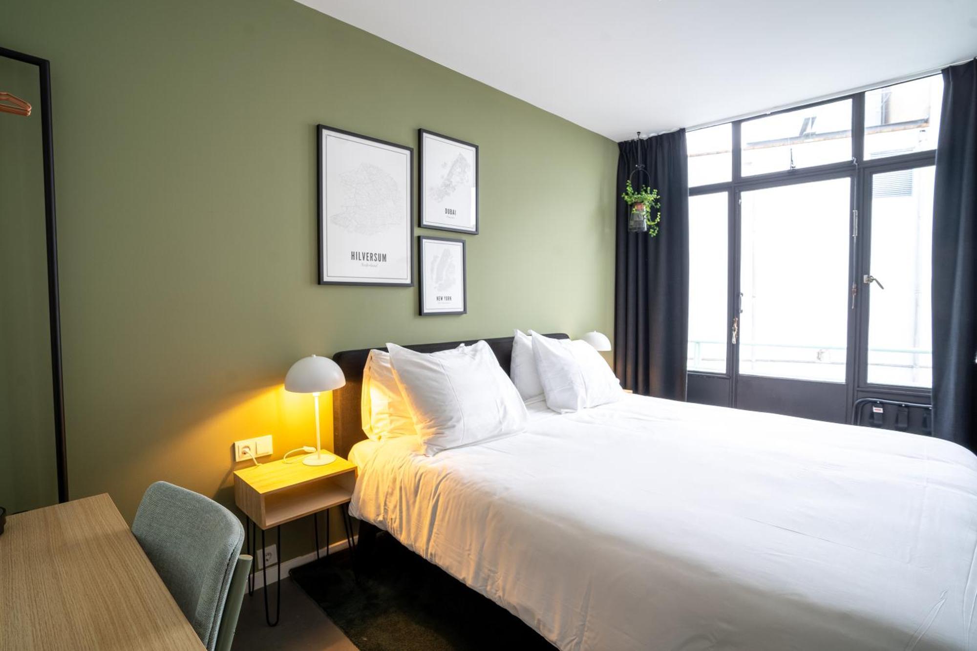 Gooiland Hotel ฮิลเวอร์ชุม ภายนอก รูปภาพ
